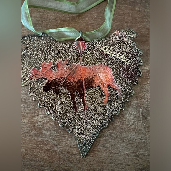 Metal plated Alaska Leaf shaped Christmas ornament with moose. - Picture 2 of 3